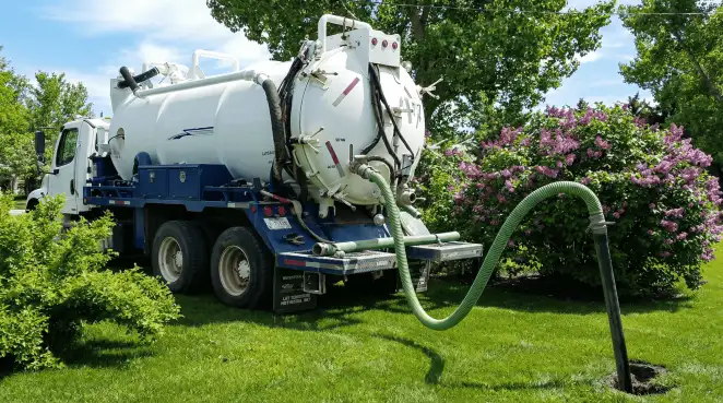 Professional vacuum truck performing residential drainage and septic maintenance in Gilbert, AZ