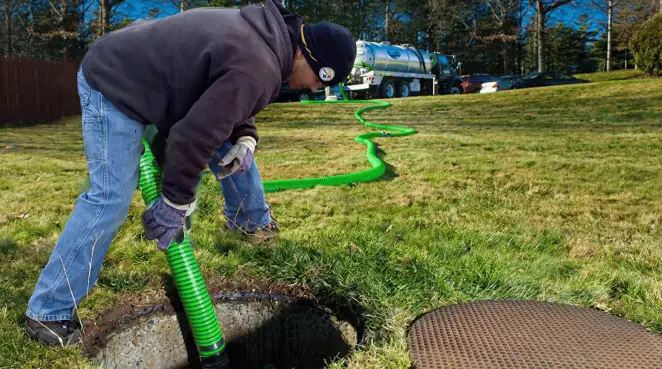 Service technician performing residential septic pumping and drainage maintenance in Gilbert, AZ